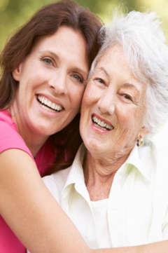 woman hugging her elderly mother 