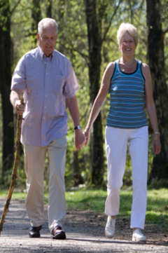 two seniors walking outdoors 