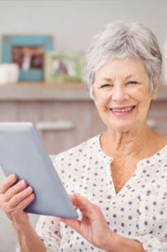 elderly woman using a tablet