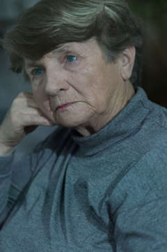 older woman looking bored 