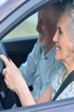 senior couple driving 