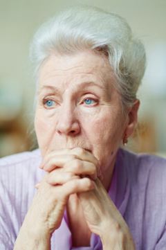 older woman looking sad 