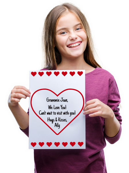 Young girl holding heart message