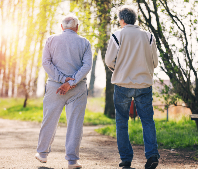 two men walking outside