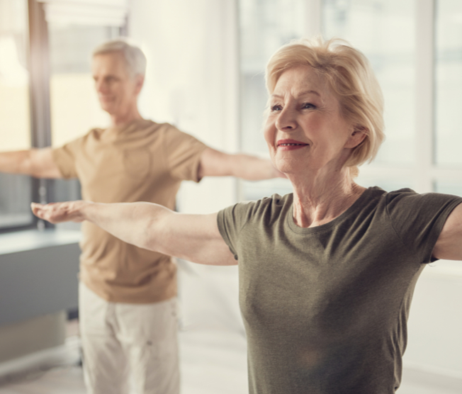 older man and woman exercising