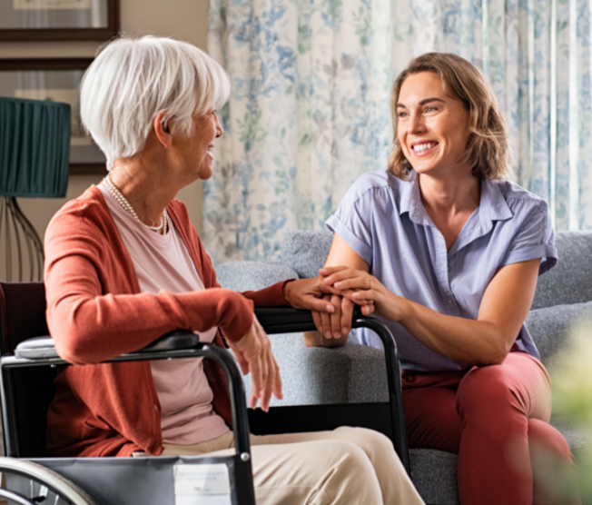 adult woman comforting senior woman