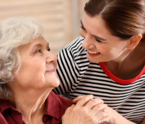 caregiver with elderly woman