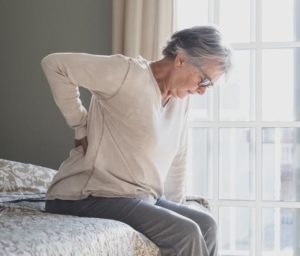 senior woman suffering back pain