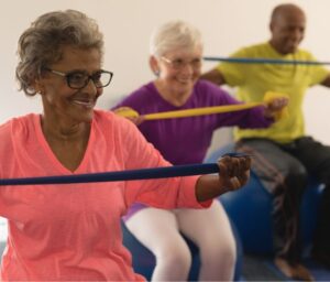 happy seniors using resistance bands